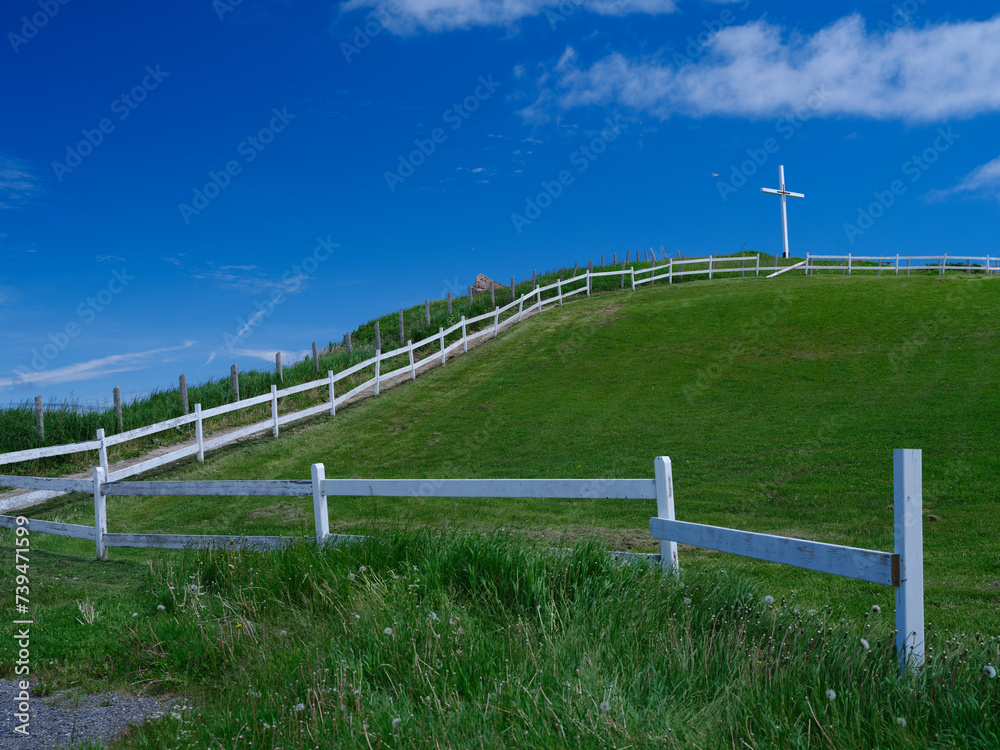 White Cross on the Hilltop at the Mont Joli Lookout in Perce on the Gaspe Peninsula on the Gulf of St. Lawrence in Quebec Canada