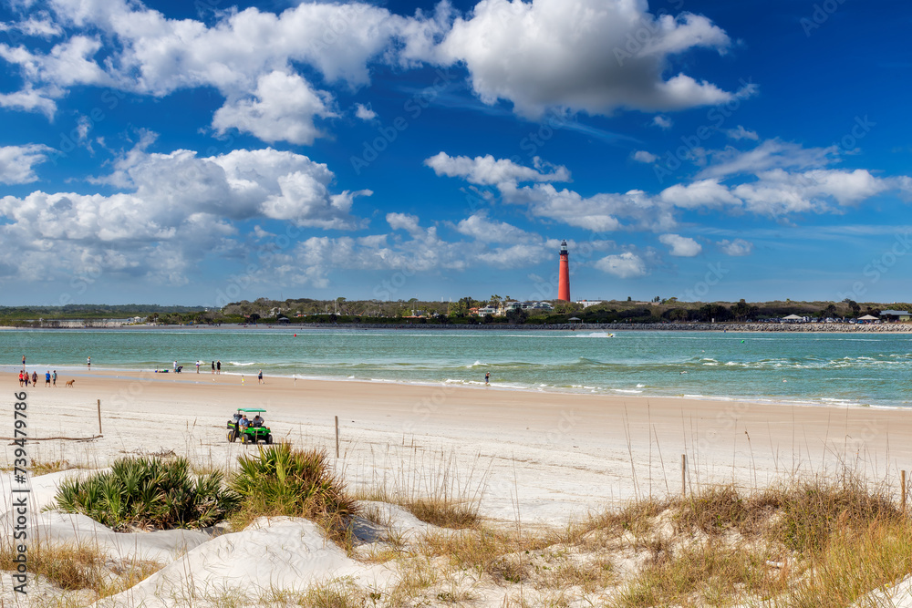 Beautiful beach and Lighthouse Ponce de Leon Inlet from New Smyrna beach, Florida.