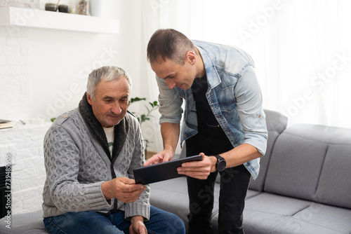 Elderly son takes care of ill father 