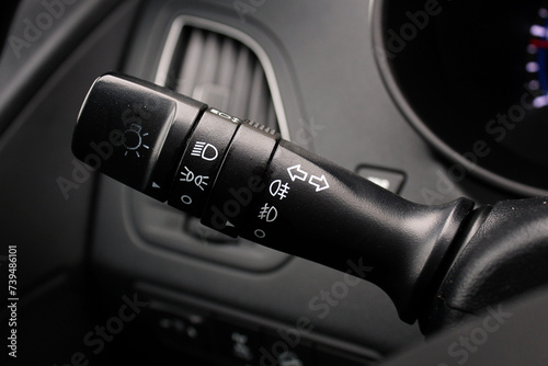 Car interior with light switch. Car lighting control understeering switch. photo