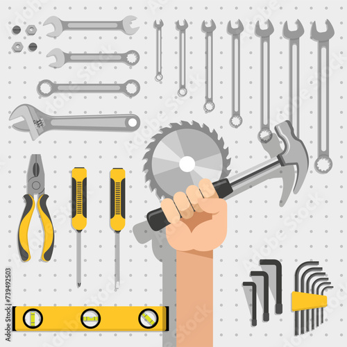 Painel de ferramentas de reparo contendo serra, martelo, chave inglesa, medidor de nível, alicate e chave de fenda photo