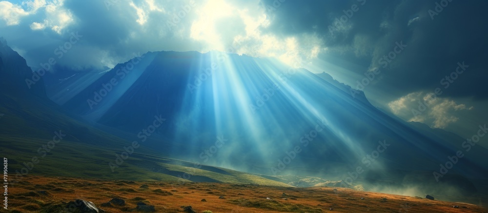 Majestic mountain range basking in a brilliant sunbeam on a clear day