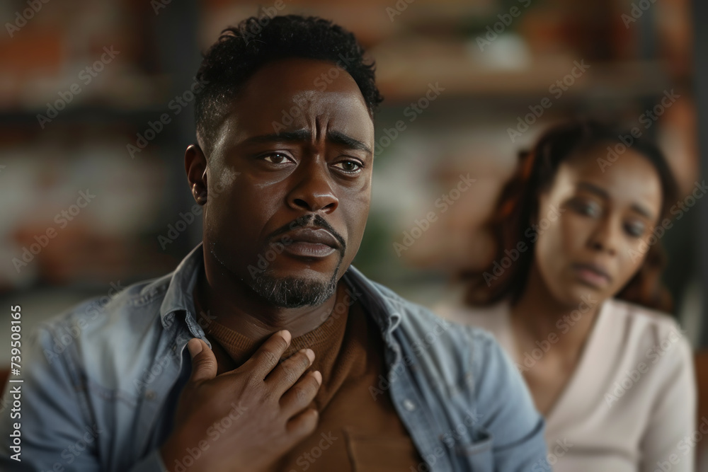 Remorseful Man with Woman in Background Remorseful Man with Woman in Background