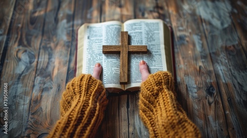 A woman who believes in a higher power is pictured holding a wooden cross on ...
