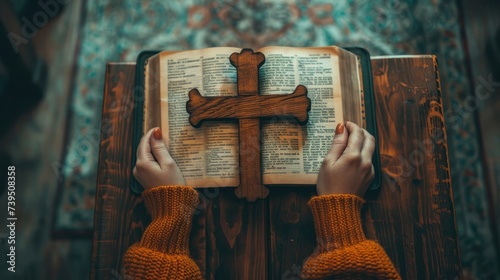 A woman who believes in a higher power is pictured holding a wooden cross on ...