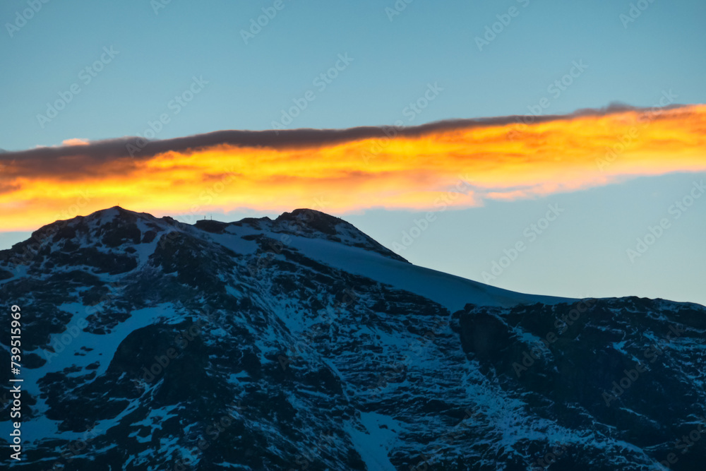 Panoramic sunset view of majestic mountain peaks in High Tauern National Park, Salzburg Carinthia border, Austria. Tranquil atmosphere in remote Austrian Alps. Looking from cottage Hagener Huette