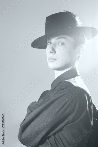 portrait of a young man in a suit, shot in a studio in black and white