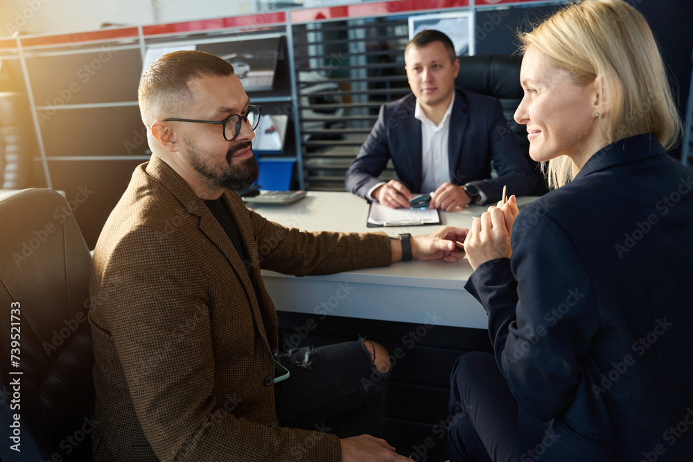 Two people sitting looking at each other