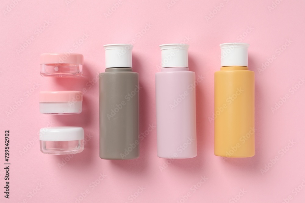 Cosmetic travel kit on pink background, flat lay. Bath accessories Cosmetic travel kit on pink background, flat lay. Bath accessories