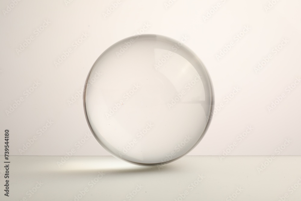View of transparent glass ball on white background View of transparent glass ball on white background