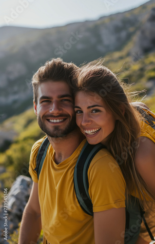 young man and woman hiking in mountain in sunny day