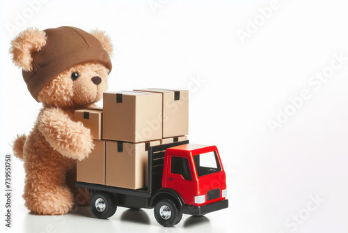 Little bear stacks cardboard boxes on a truck. Place for text. photo