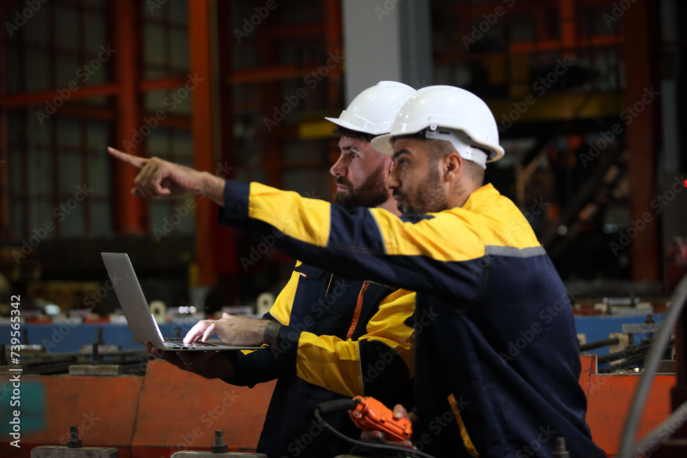 worker or engineer working in factory with safety uniform , safety hat and safety glasses , image is safety concept or happy workplace