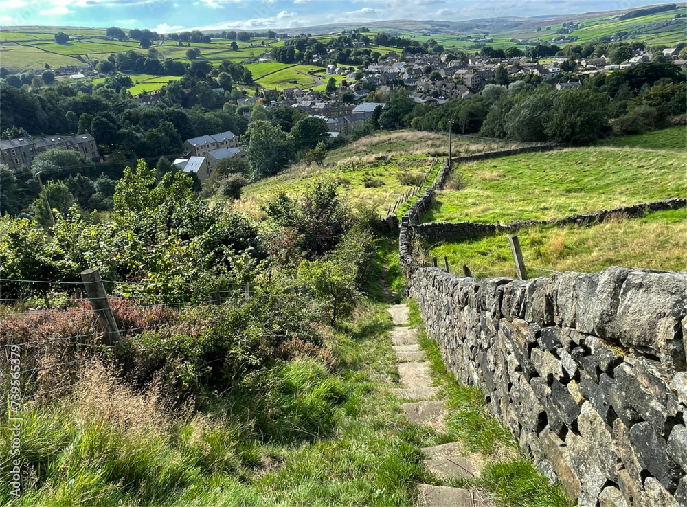 Panoramic landscape, over Oxenhope, with fields, dry stone walls, and distant hills near, Height Lane, Oxenhope, UK