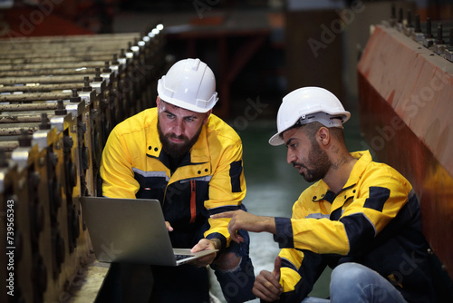 worker or engineer working in factory with safety uniform , safety hat and safety glasses , image is safety concept or happy workplace