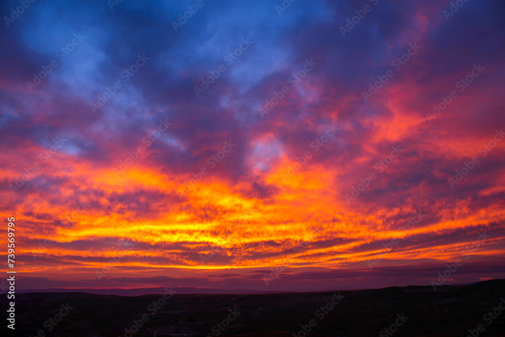 A red sky behind clouds. amazing sunset