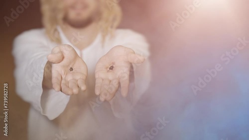 Jesus Christ shows scars on hands stigmata from wounds after crucifixion photo
