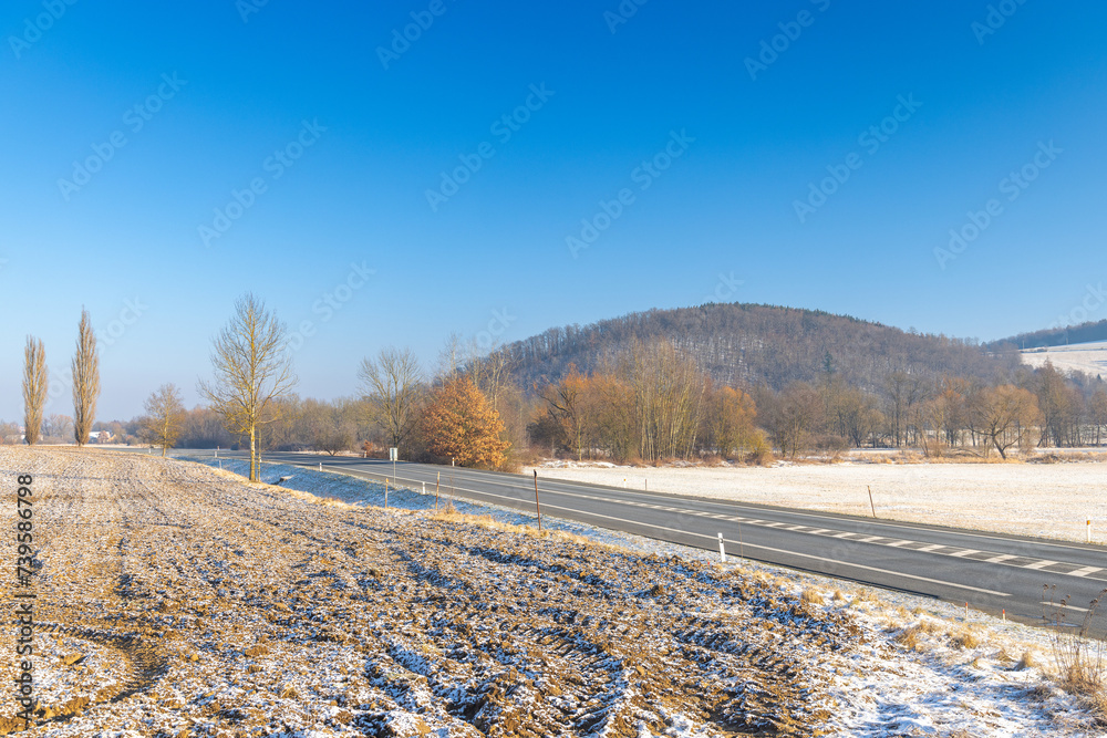 Winter snowy country with road at sunny day. Region Pilsen in Czech Republic, Europe. Winter snowy country with road at sunny day. Region Pilsen in Czech Republic, Europe.