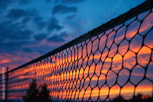 Sunset sky behind tennis net