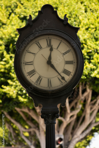 Afternoon view of a historic clock in downtown Tustin, California, USA.