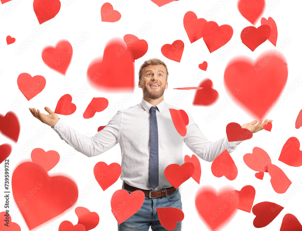 Excited businessman under red falling hearts Excited businessman under red falling hearts