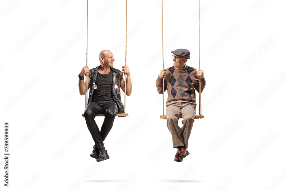 Punk and an elderly man sitting on swings and looking at each other Punk and an elderly man sitting on swings and looking at each other