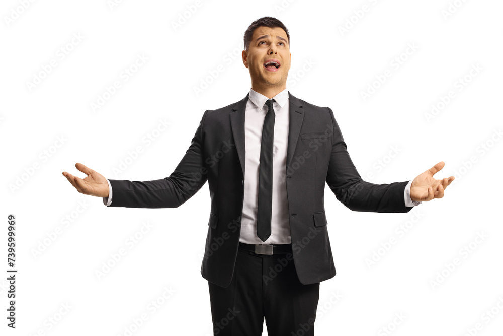 Businessman gesturing with hands and looking towards sky Businessman gesturing with hands and looking towards sky