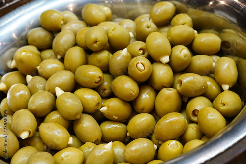 Green olives with garlic. Close up. 