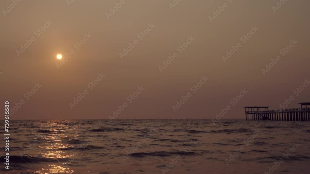 Aerial view of the sunset horizon over the sea. The path of the sun is reflected on the surface of the sea. The beauty of nature with golden sunlight. Aerial view of the sunset horizon over the sea. The path of the sun is reflected on the surface of the sea. The beauty of nature with golden sunlight.