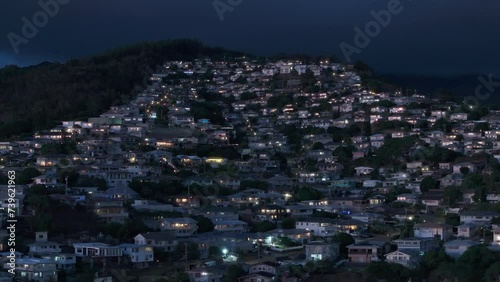 Aerial view of residential district below of Waahila Ridge State Recreation Area. Suburban district of Honolulu capital city Hawaii State at night. Real estate houses on hills at tropical Oahu island photo