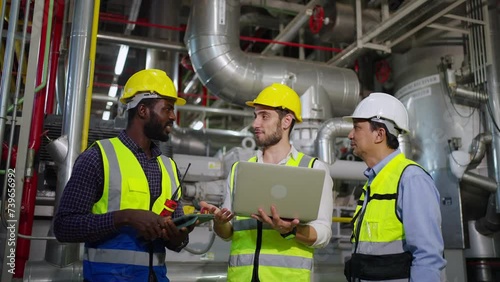 Wallpaper Mural Group of Diversity electrical engineer in safety uniform working together at factory site control room. Industrial technician worker maintenance and checking power system at manufacturing plant room. Torontodigital.ca