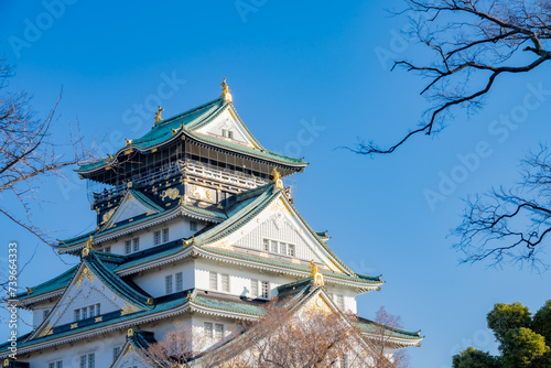 Landscape view Osaka's landmark Osaka Castle castle tower that shines in the blue sky, Osaka Japan.