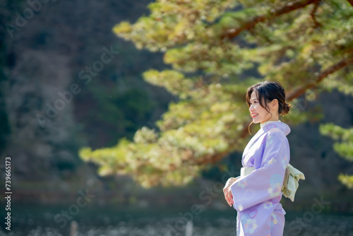 Travel, muslim travel, Arashiyama, Asian female tourist in traditional Japanese kimonos walking and travel to Tenryu-ji temple and Arashiyama city, Kyoto, Arashiyama, Japan.