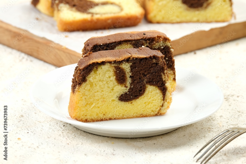 Delicious Sweet Homemade Chocolate and Vanilla Marble Loaf Cake.on wooden board	