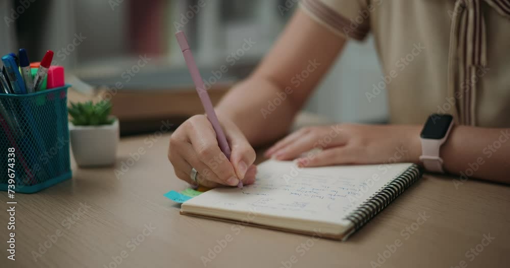 Footage steady shot,Selective focus, Hands of Young asian woman sitting at desk holding pen making notes in diary at home, creative thoughts to journaling, idea and inspiration
