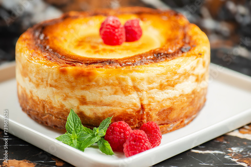 Delicious soft-baked creamy Patterson cheesecake with a spongecake base.