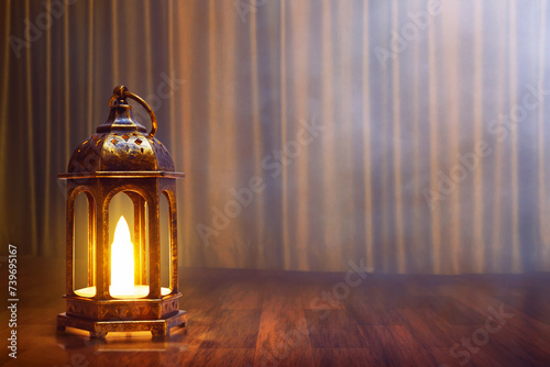 Arabic lantern on wooden floor with golden curtain, Ramadan kareem background