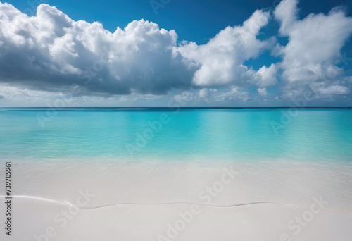 Pristine white sandy beach with turquoise sea under a sunny sky with fluffy clouds, encapsulating tranquility. 