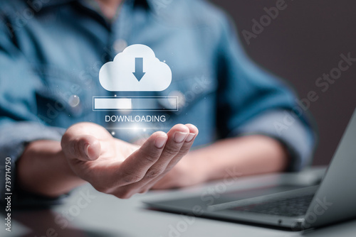Download processing data concept. Downloading data from cloud storage. Person using laptop with downloading bar on virtual screen for download files.