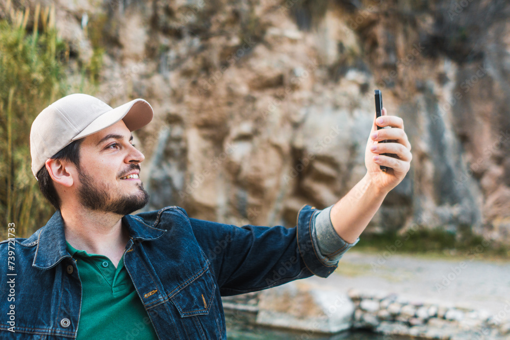 Man taking a selfie with a smartphone Man taking a selfie with a smartphone