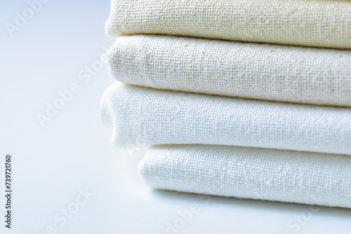 stack of white cotton clothes  pile of clothing on white background
