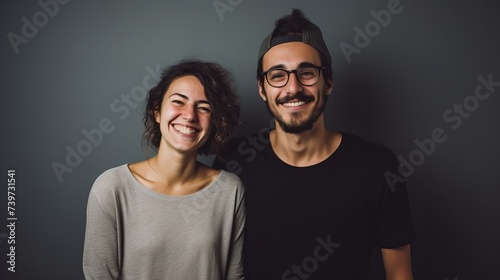 Smiling Couple Posing Against Solid Color Studio Background - Joyful Expression