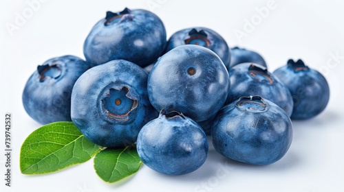 Fresh Blueberries with Green Leaves Isolated on White