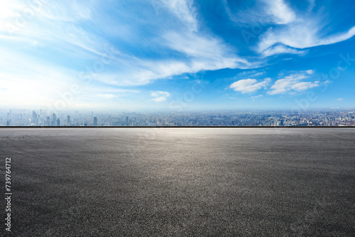 Empty asphalt road and city skyline ,high angle view