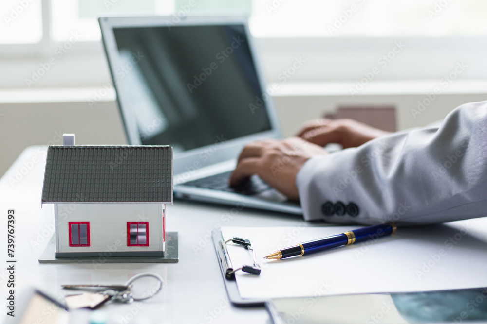 Fototapeta premium Real estate brokers are offering sample homes for customers choose from and recommending estate insurance promotions help protect their properties. Concept of offering real estate and home insurance