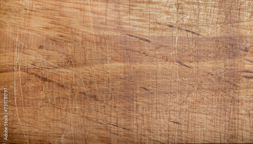Texture of a scratched kitchen board; saw cut wood; brown color