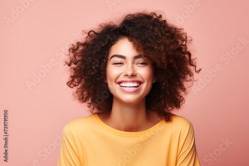 fashionable young woman on pink background, studio photo
