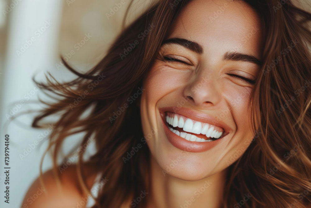 Beautiful girl model with clear skin without makeup. Cosmetology and facial skin care. The girl laughs and smiles on a plain background. banner with place for text.