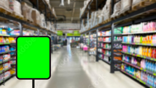 Blurred background Supermarket and green sign. Business background. Copy space.