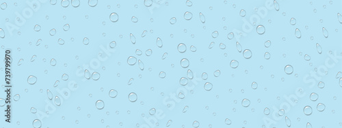 Rain splatters on the blue glass. A drop of water. Dew drops. Vector background
